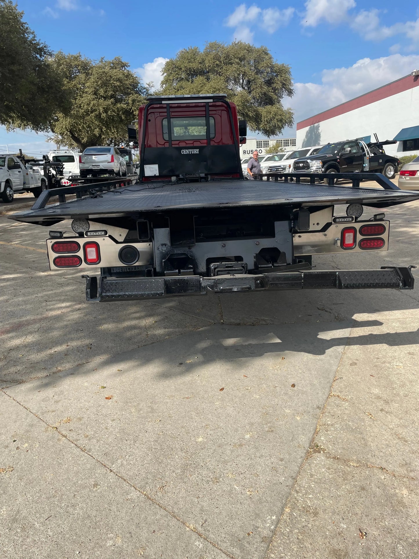 2023 Red extended cab HINO w/ Century 12 series LCG Sales Units