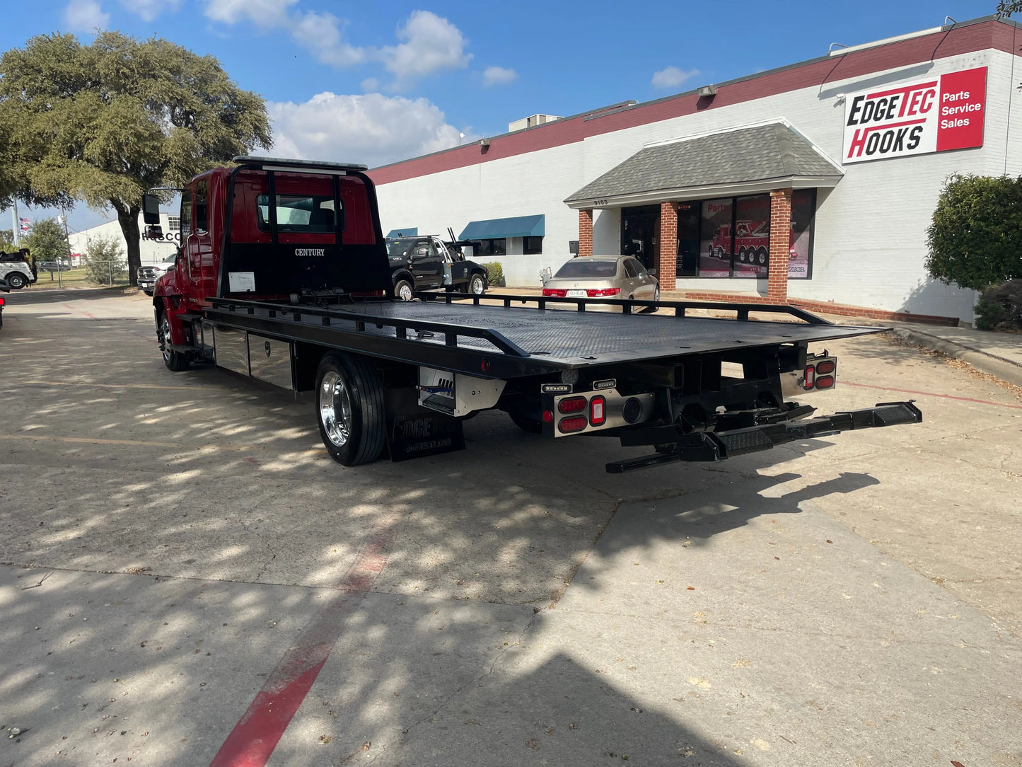2023 Red extended cab HINO w/ Century 12 series LCG Sales Units