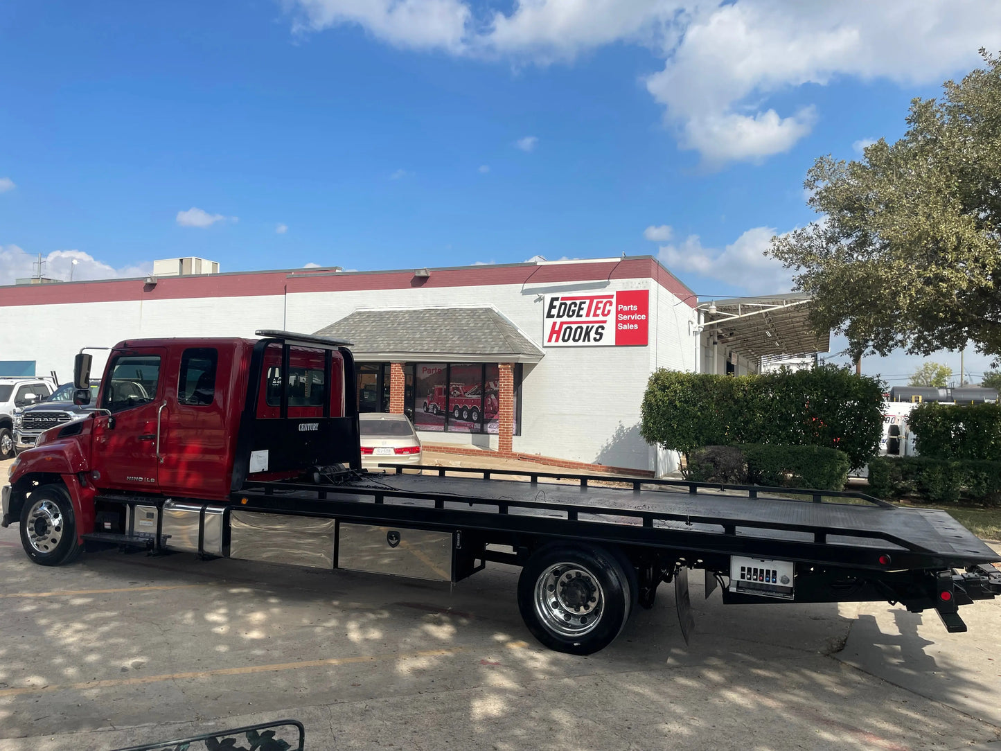 2023 Red extended cab HINO w/ Century 12 series LCG Sales Units