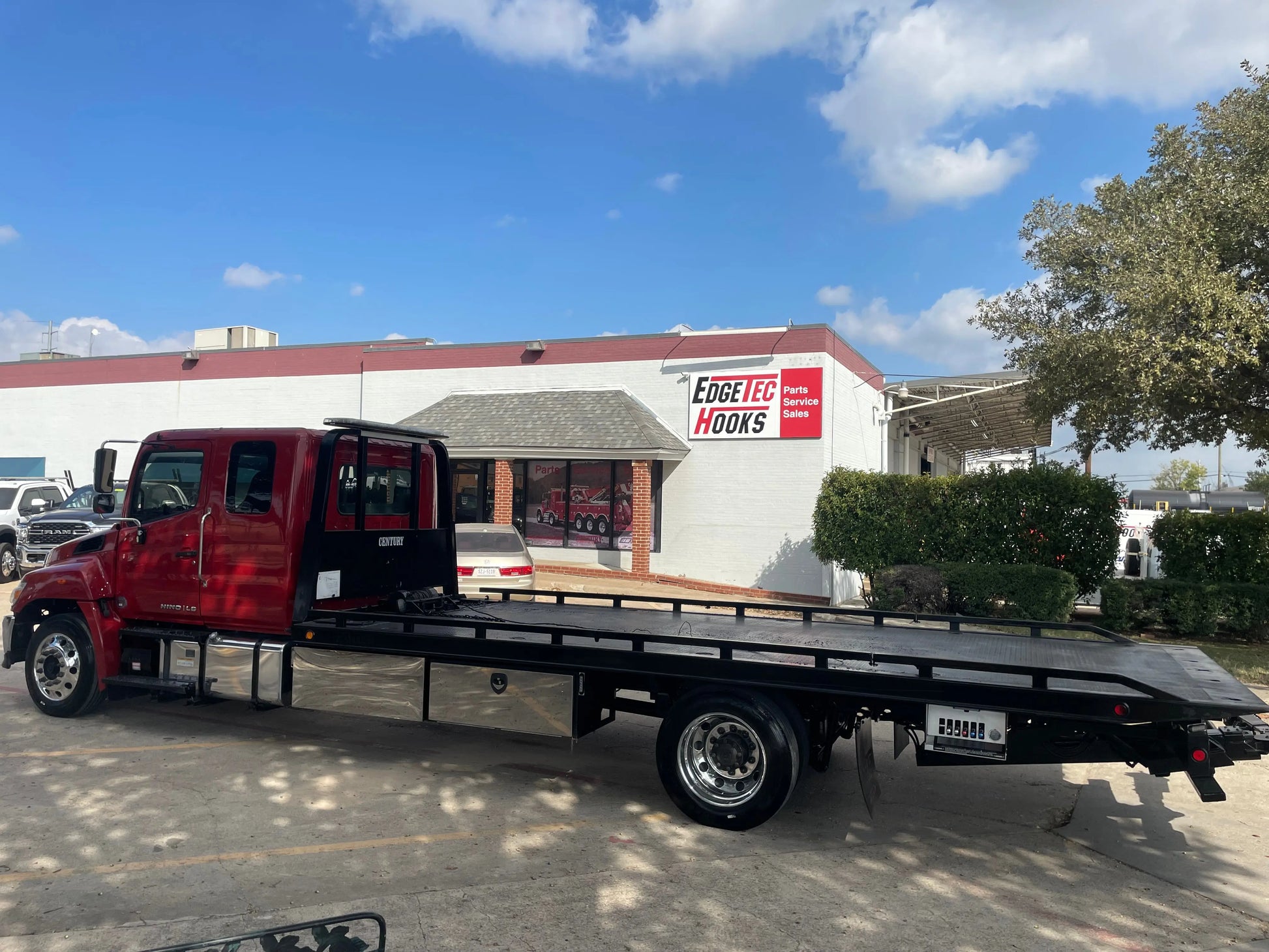 2023 Red extended cab HINO w/ Century 12 series LCG Sales Units